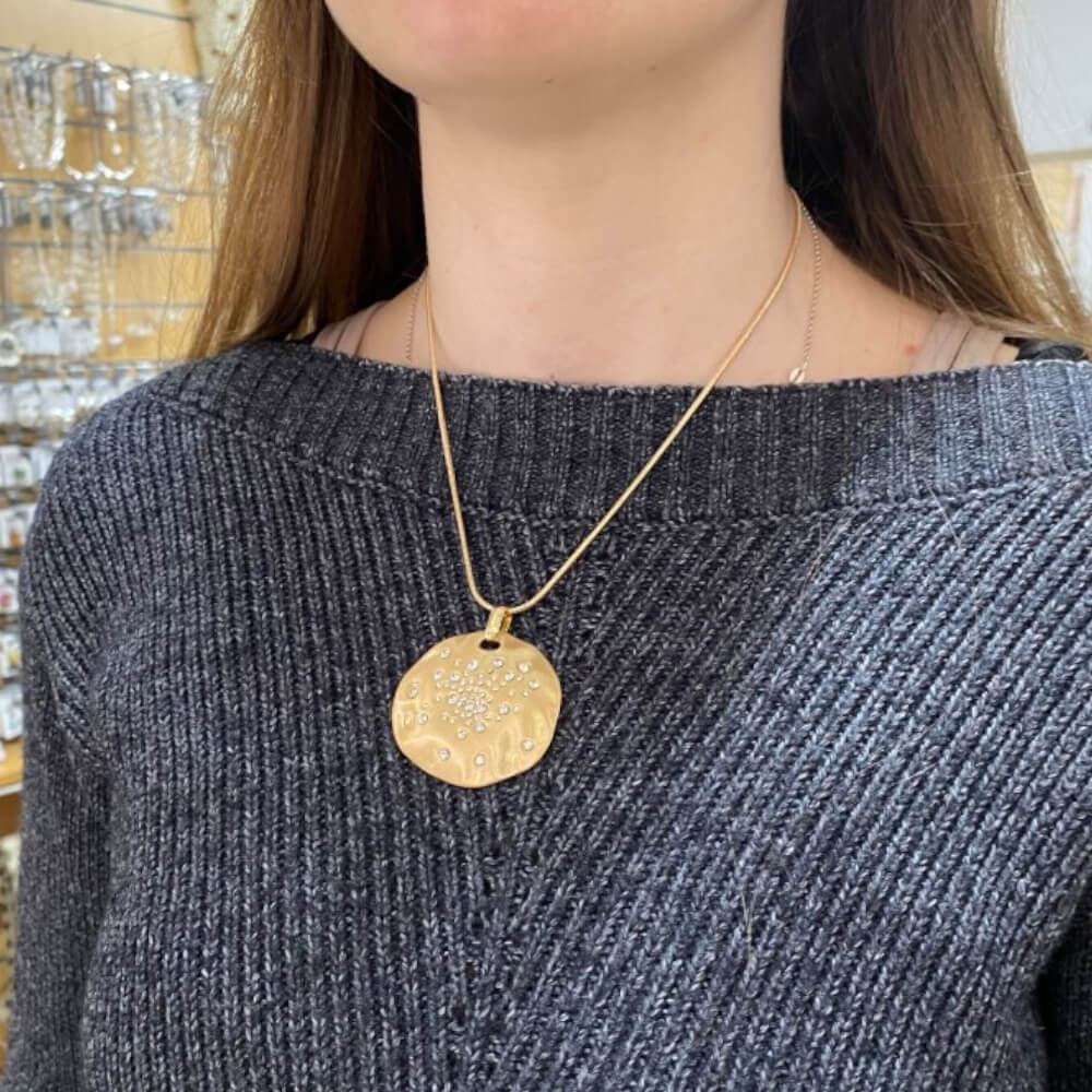 Gold Tone Necklace with Dimpled Pendant Studded With Crystals (M406)