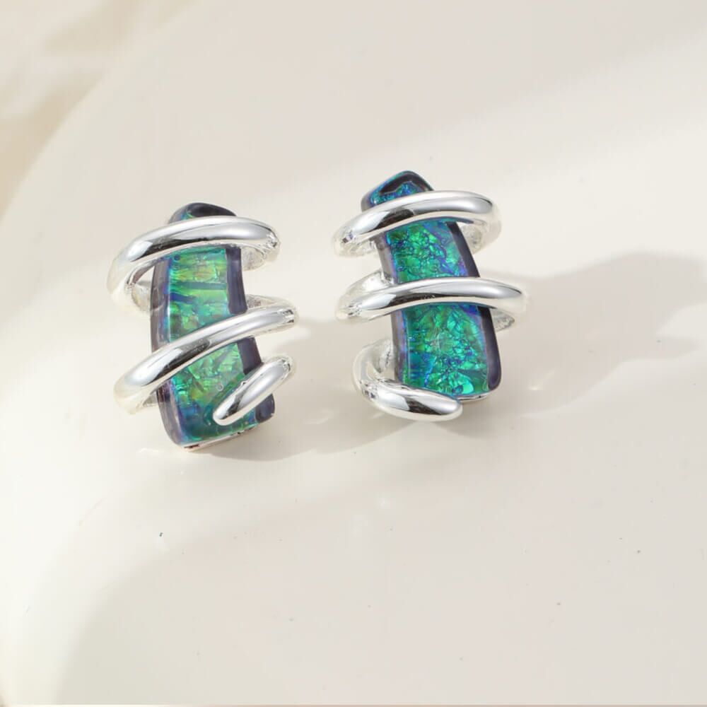 Shimmery Blue/Green Stones in Swirling Cage