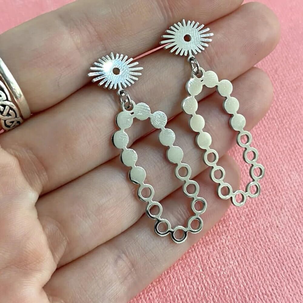 stainless-steel-sunburst-silver-long-drop-earrings-rueb-jewellers-york