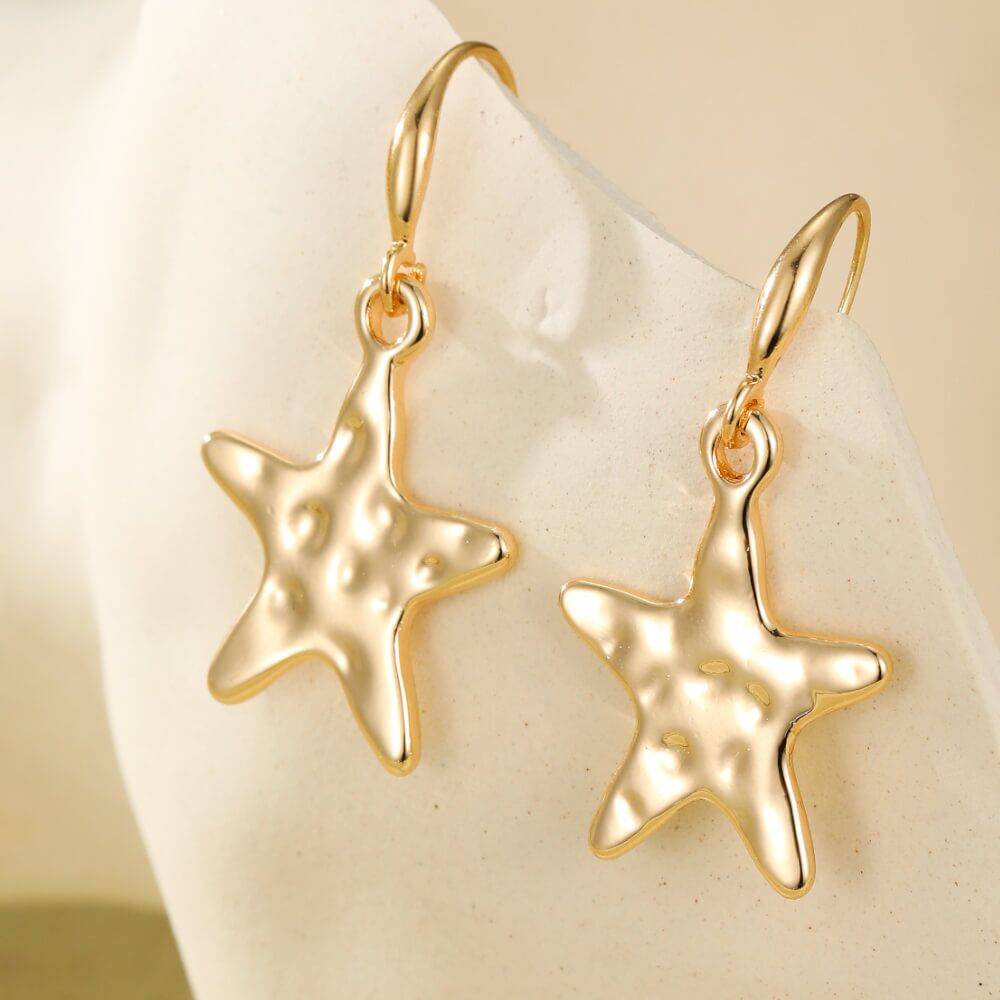 Gold Tone Drop Earrings With Hammered Stars